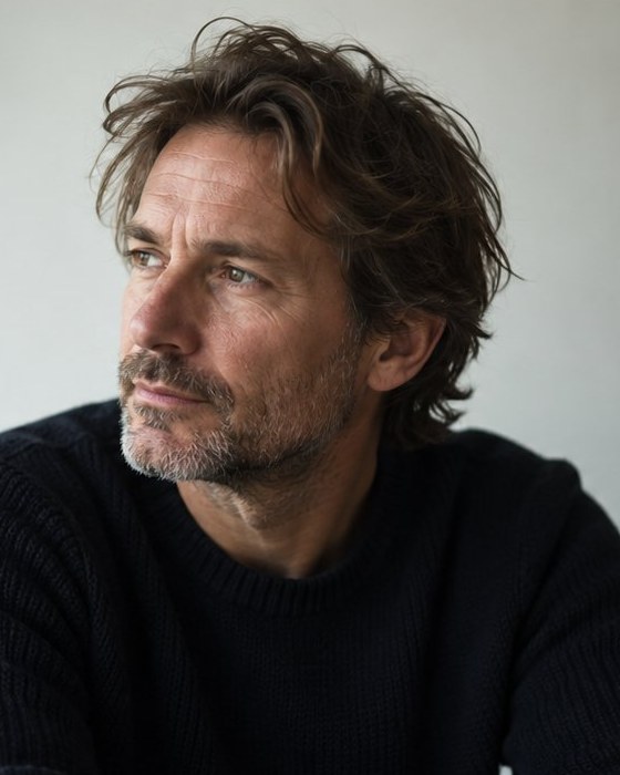 Illustrative sample portrait of a middle-aged man. Replace with Luke Webb’s real photograph before publishing.